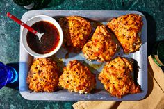 chicken patties with dipping sauce on a tray