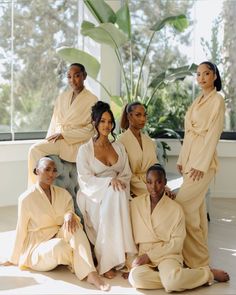 a group of women in robes posing for a photo