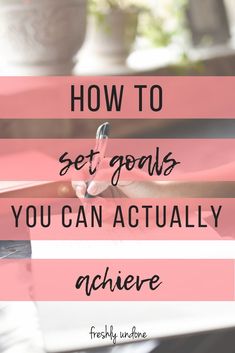 a person writing on a piece of paper with the words how to set goals you can actually achieve