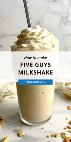 a milkshake with whipped cream and nuts on the side