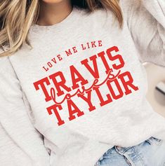 Unleash your inner Swiftie with this sweatshirt! Perfect for fans of the iconic duo, this crewneck combines comfort and style with a playful nod to the "Swift" and "Kelce" relationship. Show off your love for the game and the power couple in this quirky and fun top. Designs are printed with direct to garment, high quality inks Pop Culture Sweatshirt With Letter Print For Fans, Pop Culture Letter Print Sweatshirt For Fans, Pop Culture Letter Print Sweatshirt Fan Merchandise, Trendy Crew Neck Sweatshirt For Fan Merchandise, Pop Culture Letter Print Crew Neck Hoodie, Pop Culture Letter Print Sweatshirt In Relaxed Fit, Travis Taylor, Iconic Duo, Love Me Like