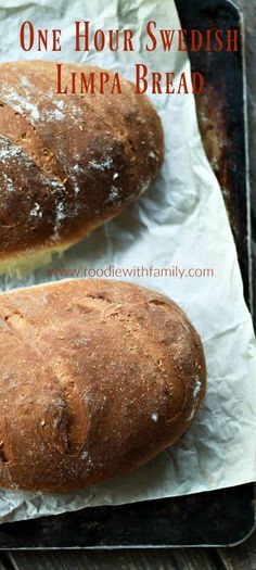 two loaves of bread sitting on top of a baking sheet with the words, one hour swedish lyma bread