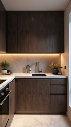 a kitchen with dark wood cabinets and white counter tops is lit by recessed lighting