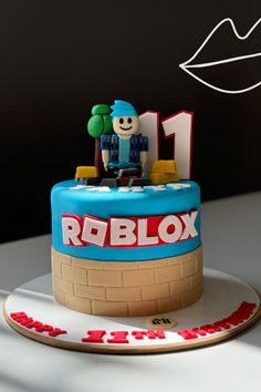 a birthday cake with a lego figure on top