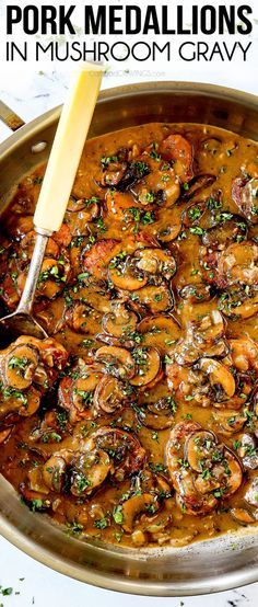 a pan filled with mushrooms and sauce on top of a table