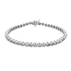 This elegant 14k white gold diamond tennis bracelet features 3.15 carats of round diamonds for a stunning and timeless look. With high-quality diamonds set in a secure setting, you can feel confident wearing this beautiful bracelet. DIAMOND 3.15 RD TCW 48 PCS I-J SI 14K WG 9.16 GRAMS SIZE 7" BB-074 Bracelet Diamond, Diamond Tennis Bracelet, Quality Diamonds, White Gold Diamonds, Beautiful Bracelet, Feel Confident