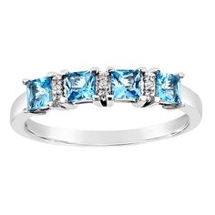 three stone ring with blue topazte and diamonds in white gold plated sterling