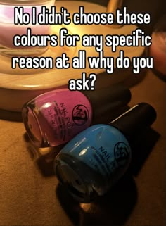 two nail polish bottles sitting next to each other on top of a table with the words, no i didn't choose these colors for any specific reason