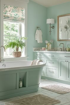 a bath tub sitting under a window next to a sink and a mirror in a bathroom