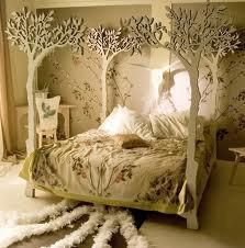 a bed with white trees on the headboard and foot board in front of it