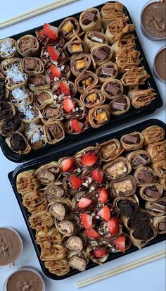 two trays filled with different types of food