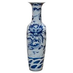 This tall blue and white "Jingdezhen" vase features three flying imperial dragons chasing the celestial pearl, which represents the heavenly bodies of sun and moon. Jingdezhen has been the capital of porcelain in China for more than two thousand years. The artists there reached artistic and firing technique maturity by the onset of the Jin Dynasty around 583 AD. Throughout history, products from Jingdezhen kilns were the official source of porcelain for the court. Hand painted with intricate det Jin Dynasty, Imperial Dragon, Dragon Motif, Asian Vases, Heavenly Bodies, Calligraphy Set, Porcelain Planter, White Ginger Jars, Blue White Porcelain