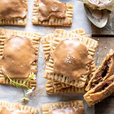 some kind of pastry with peanut butter on top and other pastries next to it