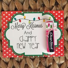 a merry christmas and happy new year card with a candy bar in front of it