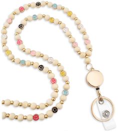 PRICES MAY VARY. 🥰 Bright & Cheerful Design: Features vibrant, handcrafted wooden beads with soft high-quality metal smiley faces, turning everyday wear into a fun and happy statement. 🥰 Lightweight & Practical: Crafted for comfort and convenience, this lanyard is ideal for securely holding badges, keys, and other essentials, making it both a functional and fashionable accessory. 🥰 Ideal Gift: Elegantly packaged, MyFavoriteK Lanyards are thoughtful presents suitable for everyone. - be it a wi Adjustable Beige Beaded Necklaces With Wooden Beads, Adjustable Beige Beaded Necklace With Wooden Beads, Adjustable Beige Wooden Beaded Necklaces, Beads Lanyard, Teacher Lanyard, Keychain Cute, Beaded Lanyards, Id Badge Reels, Smiley Faces