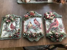 three decorative trays with birds on them