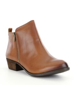 From Lucky Brand&#x2C; the Basel booties feature:Smooth leather upperSide zip entry for easy on/offSynthetic lining and sockRubber outsoleApprox. 1.2" stacked heelImported. Womens Black Booties, Lucky Stone, Shoes Collection, Fall Shoes, Dark Brown Leather, Brand Shoes, Basel, Dillard's, Suede Booties