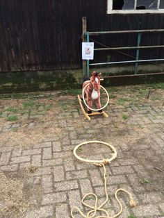 a roped off chair sitting on the side of a road next to a building