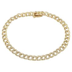 This 14 karat yellow gold cuban link bracelet features 0.44 carat total weight in round diamonds. Box safety clasp closure. Measurements: Length 7". Width 5mm. Paperclip Bracelet, Cuban Link Bracelet, Solid Gold Bracelet, Gold Link Bracelet, Everyday Bracelet, Gold Armband, Bow Jewelry, Yellow Gold Bracelet, Yellow Gold Chain