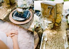 the table is set with gold sequins and white flowers, silverware, and candles