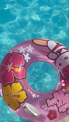 an inflatable swimming ring with hello kitty on it floating in the pool water