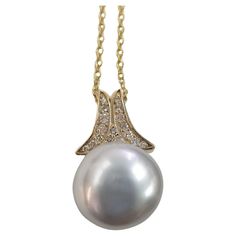 14k Yellow Gold 15 millimeter "Keshi" Pearl and Diamond pendant, a very beautiful luster. Diamonds; 17 round .32pts. Clarity: VS Color: G Main stone: 15 millimeter "Keshi" Pearl with very beautiful luster Style: Pendant Length: 16 inches Kesha, Keshi Pearls, Drop Necklace, Diamond Pendant, Jewelry Necklaces, Yellow Gold, Stone, Yellow, Pendant