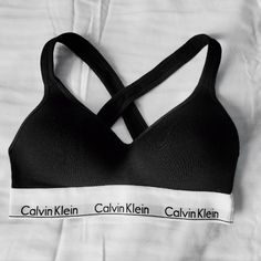 Super Cute Push Up Black And White Calvin Klein Sports Bra Size Small ! Brand New With Out Tags . Never Been Worn , It Was A Birthday Gift But Unfortunately I Had Gained Some Weight So It Didn't Fit. There's No Flaws Or Imperfections, It's In Immaculate Condition. A Must Have For Every Girl's Closet!! Calvin Klein Seamless Sports Bra With Medium Support, Calvin Klein Medium Support Seamless Sports Bra, Black Cotton Sports Bra With Built-in Bra, Calvin Klein Stretch Seamless Sports Bra, Calvin Klein Medium Support Sports Bra For Workout, Supportive Calvin Klein Activewear For Workout, Calvin Klein Fitted Sports Bra For Athleisure, Calvin Klein Fitted Athleisure Sports Bra, Calvin Klein Sporty Activewear With Medium Support