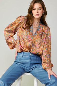 This top channels a retro-cool '70s aesthetic with its vintage-inspired floral print. Cut for a relaxed silhouette with puffed sleeves, it has a plunging V-shaped neckline framed by a contrast print and gently gathered shoulders. •V-neck with contrast trim •Gathered shoulders •Long sleeves •Elasticized cuffs •Relaxed fit Item number 2130737-1 100% Polyester Vintage Floral Blouse, Womens Printed Tops, 70s Aesthetic, 70s Floral, Image Bank, Pretty Clothes, Modest Fashion Outfits, Woven Top, Marmalade