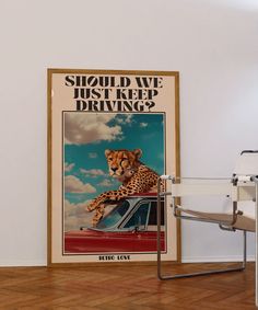 a cheetah is sitting on the hood of a red car and it says should we just keep driving?