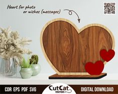 a wooden heart cutout with two hearts on it and some flowers in vases