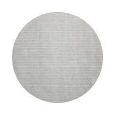 a round rug in grey and white stripes on a white background with an oval shape