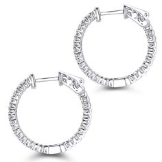 Gorgeous Diamond Hoops! These 1 inch Inside Out Diamond Hoop Earring by Luxurman feature inside out design and showcase 0.6 carats of sparkling round diamonds, each masterfully prong set in luscious 14K gold frame. Featuring a luxurious inside out design, a highly polished gold finish, and secure lock closures, these fantastic small diamond hoop earrings are available in 14K white gold, yellow gold and rose gold. Small Diamond Hoop Earrings, Diamond Earrings For Women, Gold Diamond Hoop Earrings, Classy Earrings, Pave Diamond Earrings, Diamond Huggie Earrings, Diamond Jewelry Store, Diamond Hoop Earrings, Huggies Earrings