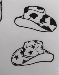 three hats with stars on them are drawn in black and white