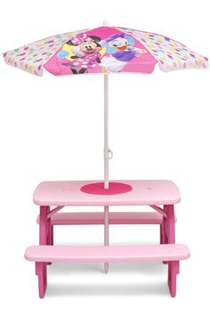 a pink picnic table with minnie mouse umbrella on it's top and bench underneath