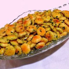 a glass dish filled with food on top of a table