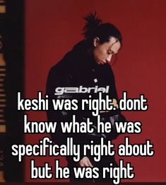 a man with dreadlocks standing in front of a red wall text reads keshi was right, dont know what he was specifically right about but he