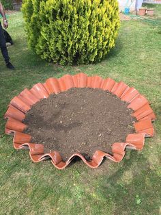 a garden bed made out of clay and dirt