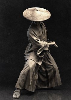 a woman with a large hat on her head