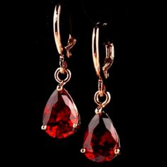 Stunning Simulated Ruby Gemstone Tear Drop Earrings. Made With Gold Tone Stainless Steel. **I Love Offers And Providing Bundle Deals!** New To Posh? Sign Up W/ Code Moonrisethrift For $10 Off Any Purchase! :) Gothic, Edgy, Witch, Witchy, Girly, Classic, Minimalist, Feminine, Hot Topic, Brandy Melville, Madewell, Anthropologie, Urban Outfitters, Gift, Boho, '90s, Y2k, Retro, Vintage Ruby Earrings Aesthetic, Red Gem Earrings, Evil Aesthetic, 90s Earrings, Seashell Earrings, Tear Drop Earrings, Gem Earrings, Ruby Earrings, Cz Stud Earrings