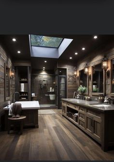 a large bathroom with two sinks and a skylight above the bathtub is shown