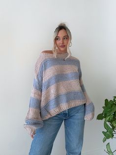 Details: Stripe sweater Knit Oversized fit Bubble sleeve Round neck Size + Fit: Model is 5'4 Wearing size S/M Fabric + Care: 80% acrylic 20% nylon Shipping + Return: Free US ground shipping on orders $100+ We offer free returns and a refund in the form of store credit with items not worn within 10 days of delivery For more info on returns visit our returns page Cozy Blue Acrylic Sweater, Blue Chunky Knit Long Sleeve Sweater, Blue Oversized Chunky Knit Sweater, Oversized Blue Chunky Knit Sweater, Casual Slouchy Chunky Knit Cropped Sweater, Blue Cozy Knit Cropped Sweater, Cozy Blue Knit Cropped Sweater, Blue Soft Knit Acrylic Sweater, Blue Knitted Sweater With Relaxed Fit