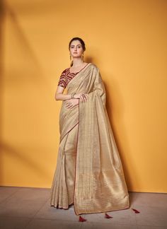 About Saree: Overall, this cream color saree with tissue silk Banarasi weaving and tassels is a stunning piece of traditional Indian attire that is perfect for any special occasion. It is a true work of art that showcases the beauty of Indian craftsmanship and is sure to make you feel confident and beautiful when you wear it. • Occasion: Party, Traditional, Festival, Wedding, Function, Engagement• Saree Fabric: Tissue Silk • Blouse Fabric: Tissue Silk • Work: Golden Zari Woven • Wash Care: Dry C Cream Color Saree, Engagement Saree, Sequence Blouse, Designer Sarees Collection, Tissue Saree, Pure Silk Saree, Printed Saree, Fancy Blouses, Work Sarees