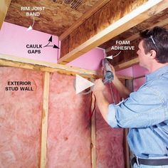 a man is working on the insulation in his house