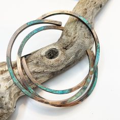 Our copper bangle cuffs are hand forged from rich jewelers copper. Each bracelet is forged by hand,given a square shape and hammered for texture. The cuffs are oxidized and given a green/blue patina. The patina on each bracelet is different and unique. You will receive 3 bracelets. Copper is the traditional 7th or 22nd anniversary gift The patina finish is sealed but please refrain from swimming or bathing while wearing to protect i * copper sensitivity *  If you have a sensitivity to copper it Artisan Electroformed Bangle Bracelets, Artisan Hand Forged Bangle Jewelry, Unique Hammered Copper Bracelets, Artisan Electroformed Cuff Bangle Bracelet, Hand Forged Copper Bangle Bracelet, Handmade Copper Bangle Bracelets, Artisan Bangle Bracelet With Patina, Unique Patina Bangle As Gift, Electroformed Copper Bangle