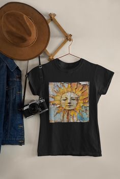 Faded wood and peeling paint give this Rustic Sun tee loads of vintage charm! A unique accent piece for your wardrobe - and a great gift-for her! Available in Black, Grey and Blue Jean The Rustic Sun Collection includes a coffee mug and a totebag Free shipping Made of soft, breathable 100% ethically grown US cotton    Rustic-Sun, sun-tee, sun-face, sun burst, sun-shirt, tshirt-gift, tshirt-for her, gifts-for her, vintage-vibe, shabbychic style, tee-for her, sunshine-tee, sunshine-tshirt, gifttee, country-vibe,                                                   S M L XL 2XL 3XL 4XL Width, in 18.25 20.25 22.00 24.00 26.00 27.75 29.75 Length, in 26.62 28.00 29.37 30.75 31.62 32.50 33.50 Sleeve length from center back, in 16.25 17.75 19.00 20.50 21.75 23.25 24.63 Size tolerance, in 1.50 1.50 1. Face Sun, Sun Burst, Sun Face, Peeling Paint, Sun Shirt, Vintage Vibe, Weathered Wood, Blue Jean, Dye T Shirt