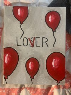 a piece of paper with red balloons on it and the words lover written in black ink