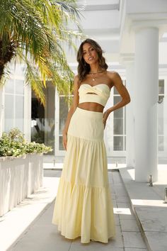 Length from waist to hem of size S: 105cm. Lemon maxi skirt. Non-lined. Cold hand wash only. Model is a standard XS and is wearing size XS. True to size. Lightweight, non-stretchy cotton fabric. Elasticised waist. Side zipper. Cotton. Enter the season of events in the most stunning maxi skirt. This sweet skirt has a tiered detail and gorgeous tight high waist fit, so this skirt was made for you! Complete the look with the matching crop and some white dainty heels.