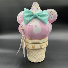 Stitch Shoppe By Loungefly Disney Minnie Mouse Soft Serve Ice Cream Crossbody Bag Is Shaped Like An Indulgent Ice Cream Cone That Looks Like Minnie Mouse. The Whipped Cream Topping, Over The Pink Strawberry Swirl, Is Covered In Embroidered Sprinkles. Gold Chains, With Adjustable, Removable Shoulder Straps, Hold The Cherry On Top: A Scented, Pink Padded Mickey Mouse Ears Shaped Charm, Complete With An Adorable Green Stem. The Strawberry Swirl Ice Cream Also Features Minnie Mouse’s Ears And Signat Pink Minnie Mouse Bag For Gift, Playful Pink Bag For Disney Trips, Halloween Camera, Snow White Book, Swirl Ice Cream, Whipped Cream Topping, Loungefly Hello Kitty, Serve Ice Cream, Disney Hercules