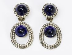 Kenneth Jay Lane Cabochon Drop Earrings. Vintage 1960’s Kenneth Jay Lane blue cabochon crystal drop earrings in good condition. Collectors item! Approximate Measurements: Length 2.3”, Width 1”Made in USA. Evening Costume Jewelry Earrings With Jewels, Vintage Jeweled Earrings For Formal Occasions, Vintage Jeweled Earrings For Evening, Vintage Jewel Earrings For Evening, Oval Cabochon Earrings For Evening, Blue Party Earrings With 17 Jewels, Vintage Cabochon Earrings For Evening, Vintage Blue Earrings For Evening, Blue Mid-century Jewelry For Formal Occasions