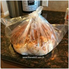 a bag of bread sitting on top of a counter next to an instant pressure cooker